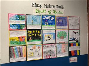 Photo shows drawings made by children illustrating their understanding of the Underground Railroad.